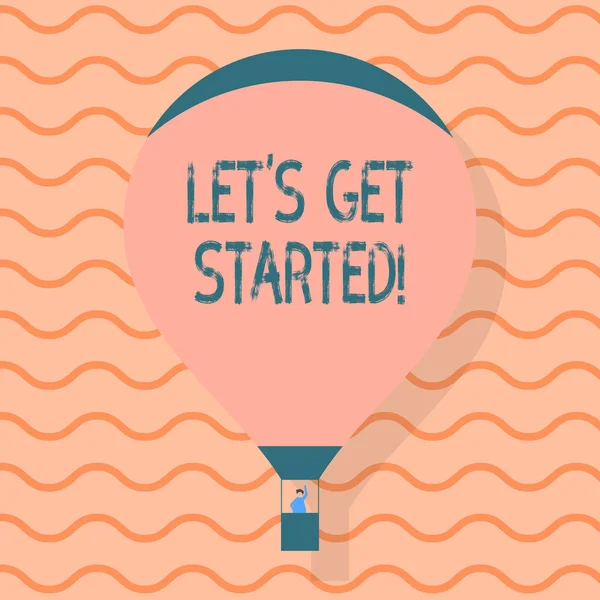 Scrittura concettuale a mano che mostra Let S Get Started. Business foto testo incoraggiando qualcuno a iniziare a fare qualcosa di mongolfiera galleggiante con i passeggeri che saluta dalla gondola . — Foto Stock