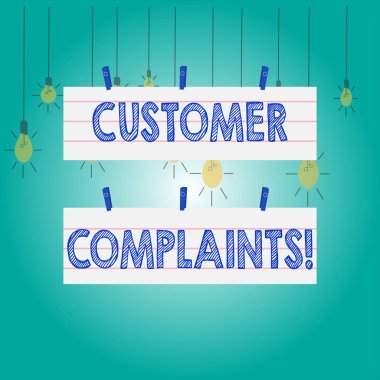 Word writing text Customer Complaints. Business concept for expression of dissatisfaction on a consumer s is behalf Two Color Blank Strip Size Lined Paper Sheet Hanging Using Blue Clothespin.