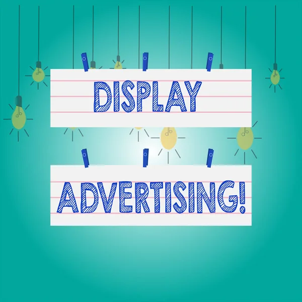 Word writing text Display Advertising. Business concept for online advertising that is typically a designed image Two Color Blank Strip Size Lined Paper Sheet Hanging Using Blue Clothespin.