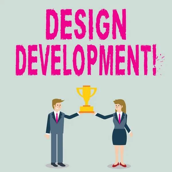 Word writing text Design Development. Business concept for technical aspects of materials and building systems Man and Woman in Business Suit Holding Together the Championship Trophy Cup. — 스톡 사진