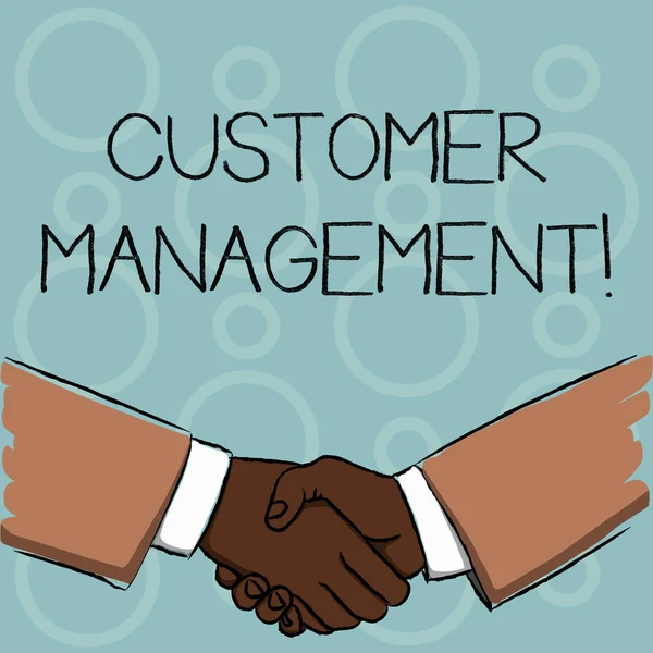 Writing note showing Customer Management. Business photo showcasing customer retention and ultimately driving sales growth Businessmen Shaking Hands Form of Greeting and Agreement.