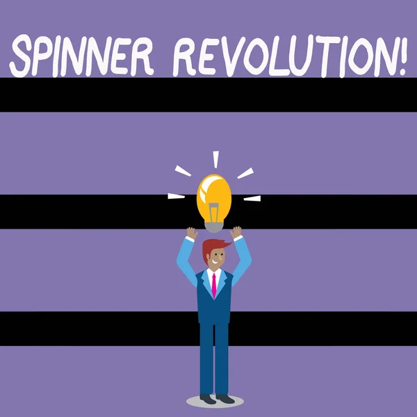 Nota di scrittura che mostra Spinner Revolution. Foto aziendale in mostra un giocattolo che aiuta ad alleviare lo stress e far fronte all'ansia Businessman Alza le braccia verso l'alto con l'icona della lampadina illuminata sopra . — Foto Stock