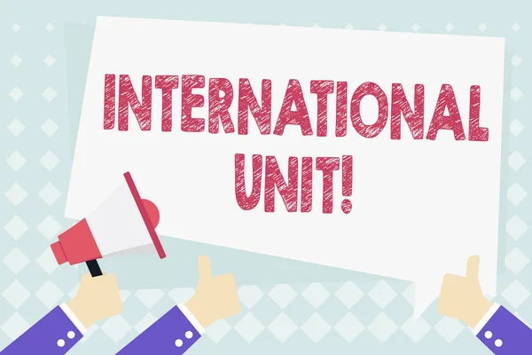 Conceptual hand writing showing International Unit. Business photo showcasing the internationally accepted amount of a substance Hand Holding Megaphone and Gesturing Thumbs Up Text Balloon.