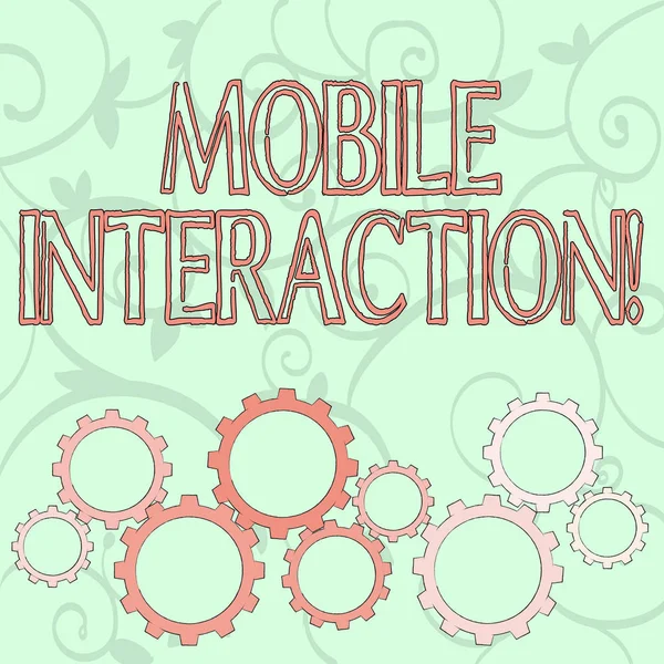Writing note showing Mobile Interaction. Business photo showcasing the interaction between mobile users and computers Colorful Cog Wheel Gear Engaging, Interlocking and Tesselating. — 스톡 사진