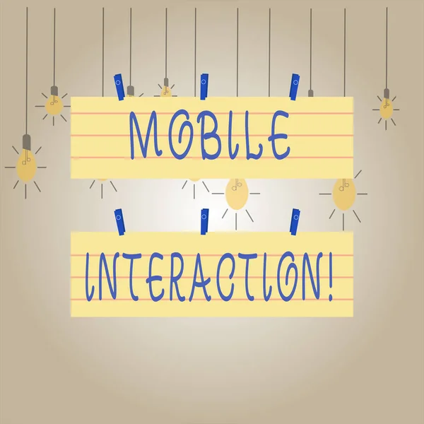 Writing note showing Mobile Interaction. Business photo showcasing the interaction between mobile users and computers Strip Size Lined Paper Sheet Hanging Using Blue Clothespin. — 스톡 사진