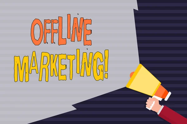 Handwriting text Offline Marketing. Concept meaning Advertising strategy published outside of the internet Hand Holding Megaphone with Blank Wide Beam for Extending the Volume Range.