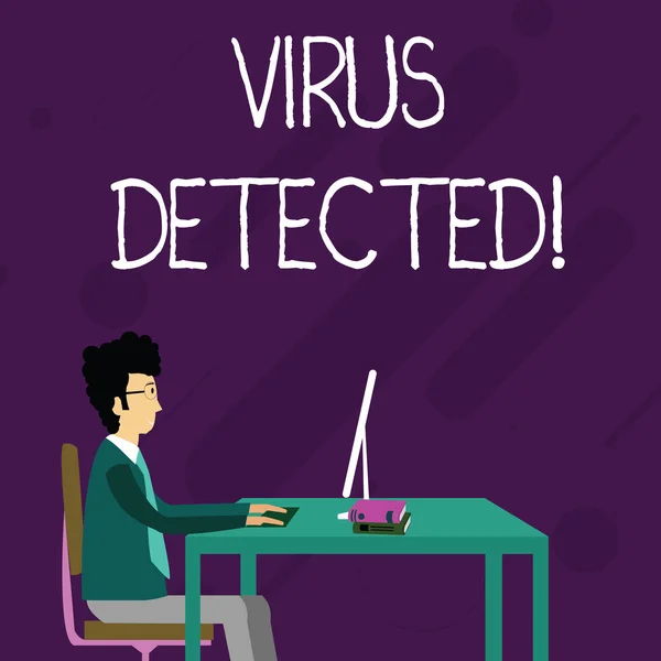 Conceptual hand writing showing Virus Detected. Business photo showcasing Identified a malware that possible can harm the computer Businessman Sitting on Chair Working on Computer and Books. — Stock Photo, Image