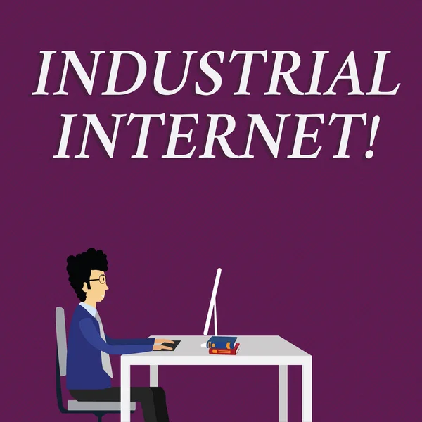 Writing note showing Industrial Internet. Business photo showcasing use of the internet of things in industrial sectors Businessman Sitting on Chair Working on Computer and Books.