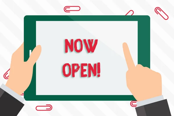Text sign showing Now Open. Conceptual photo leave door or windows not closed or barred at this current time Businessman Hand Holding, Pointing and Touching Colorful Tablet Blank Screen.