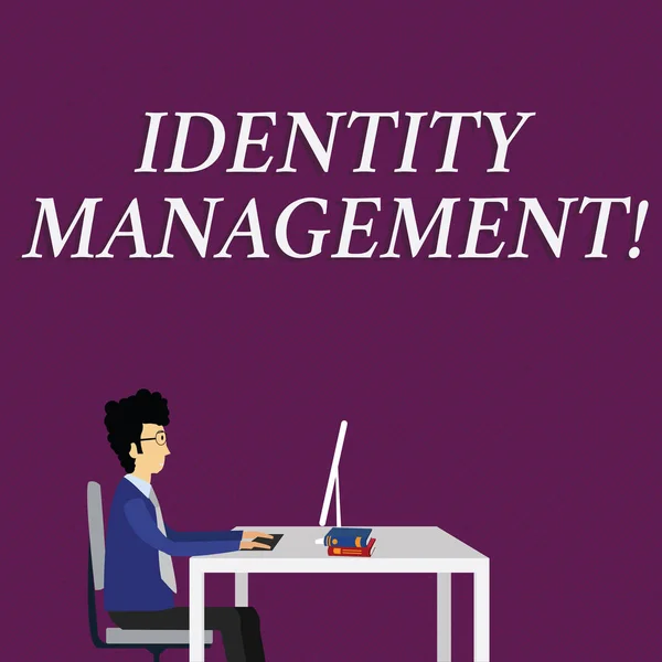 Writing note showing Identity Management. Business photo showcasing administration of individual identities within a system Businessman Sitting on Chair Working on Computer and Books.