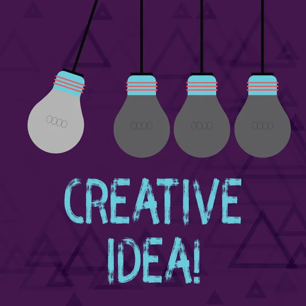 Writing note showing Creative Idea. Business photo showcasing the overarching concept that captures audience interest Color Pendant Bulb Hanging with One Different Shade Lightbulb. — 스톡 사진