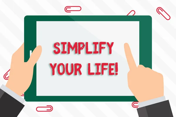 Text sign showing Simplify Your Life. Conceptual photo focused on important and let someone else worry about less ones Businessman Hand Holding, Pointing and Touching Colorful Tablet Blank Screen.