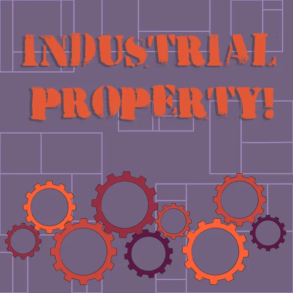 Text sign showing Industrial Property. Conceptual photo the intangible ownership of a trademark or patent Colorful Cog Wheel Gear Engaging, Interlocking and Tesselating Flat Style. — Stock Photo, Image