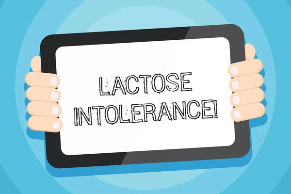 Textzeichen mit Laktoseintoleranz. konzeptionelle Foto Verdauungsproblem, wo Körper nicht in der Lage ist, Laktose zu verdauen Farbe Tablet-Smartphone mit leerem Bildschirm Handheld von der Rückseite des Gadgets. — Stockfoto