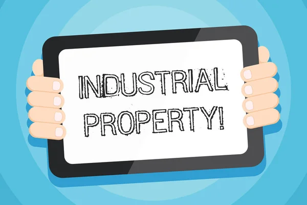 Text sign showing Industrial Property. Conceptual photo the intangible ownership of a trademark or patent Color Tablet Smartphone with Blank Screen Handheld from the Back of Gadget. — Stock Photo, Image