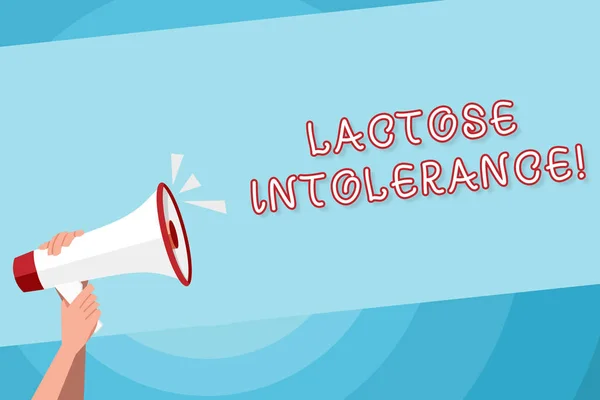 Text sign showing Lactose Intolerance. Conceptual photo digestive problem where body is unable to digest lactose Human Hand Holding Tightly a Megaphone with Sound Icon and Blank Text Space.