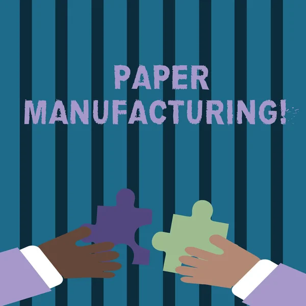 Text sign showing Paper Manufacturing. Conceptual photo company that use wood as raw material and produce paper Two Hands Holding Colorful Jigsaw Puzzle Pieces about to Interlock the Tiles.