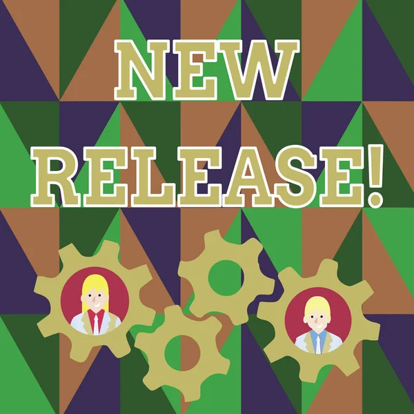 Text sign showing New Release. Conceptual photo announcing something newsworthy recent product Two Business People Each Inside Colorful Cog Wheel Gears for Teamwork Event.