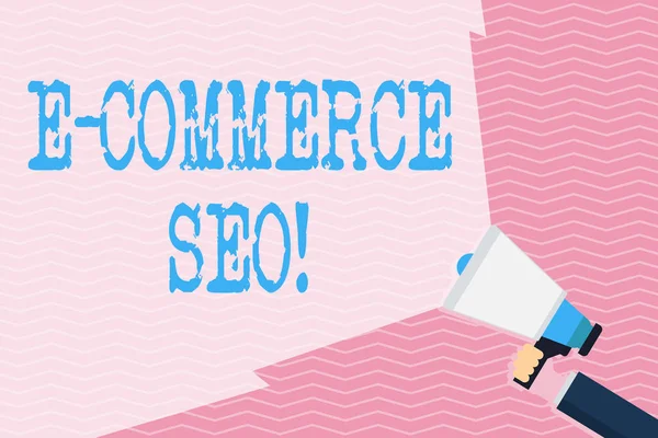 Writing note showing E Commerce Seo. Business photo showcasing making your online store more visible in the search engine Hand Holding Megaphone with Wide Beam Extending the Volume.