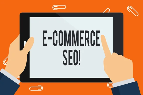 Texto de escritura de palabras E Commerce Seo. Concepto de negocio para hacer su tienda en línea más visible en el motor de búsqueda Empresario de mano sosteniendo, señalando y tocando la pantalla en blanco de la tableta colorida . — Foto de Stock