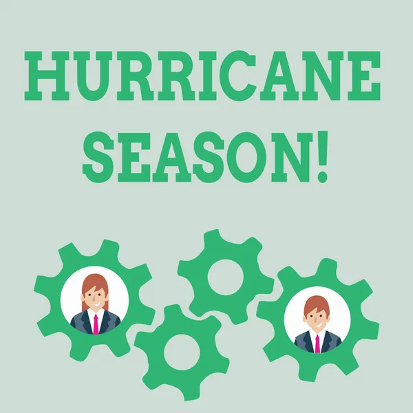 Text sign showing Hurricane Season. Conceptual photo time when most tropical cyclones are expected to develop Two Business People Each Inside Colorful Cog Wheel Gears for Teamwork Event.