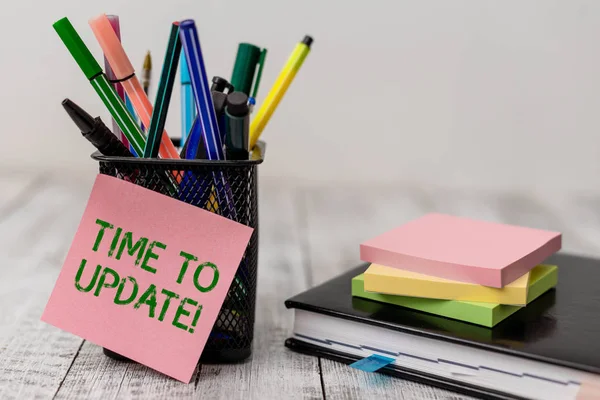 Handwriting text Time To Update. Concept meaning act updating something someone or updated version program Writing equipment and note paper sheets with agenda book on the wooden desk. — Stock Photo, Image
