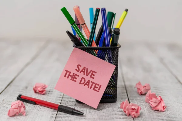 Conceptual hand writing showing Save The Date. Business photo text remember not schedule anything else on this day Writing equipment and paper scrap with blank sheets on wooden desk. — Stock Photo, Image