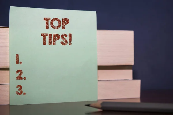 Handwriting text Top Tips. Concept meaning small but particularly useful piece of practical advice Close up three wooden different sizes rectangle boxes paper sheet pencil.