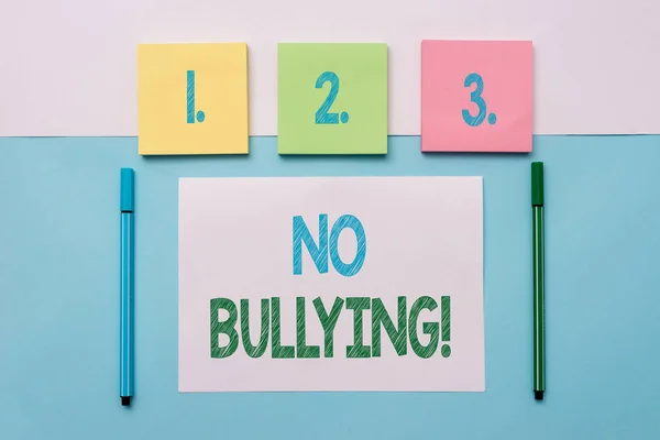 Text sign showing No Bullying. Conceptual photo stop aggressive behavior among children power imbalance Note papers and stationary placed sideways on top of softhued backdrop.