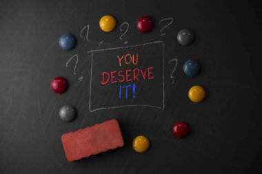 You Deserve It. Business photo vitrine nitelikleri veya eylemleri nedeniyle olmalıdır gösteren not yazma.