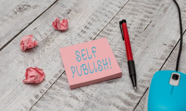 Text sign showing Self Publish. Conceptual photo writer publish piece of ones work independently at own expense Writing equipment and computer mouse with paper sheets on the wooden desk. — Stock Photo, Image
