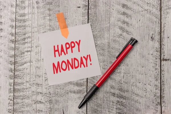 Text sign showing Happy Monday. Conceptual photo telling that demonstrating order to wish him great new week One plain blank paper sheet and a pen attached with wooden textured table.