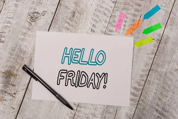 Handwriting text Hello Friday. Concept meaning used to express happiness from beginning of fresh week Plain note paper and line arrow stickers with pen above the wooden table.