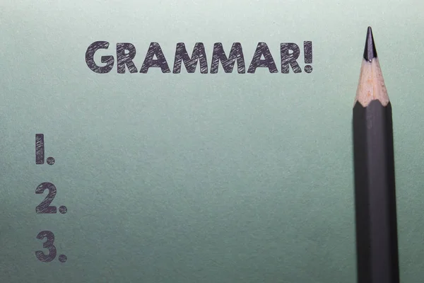 Writing note showing Grammar. Business photo showcasing whole system structure language syntax and morphology Close up front view pencil lying on stationary sheet paper Writing.