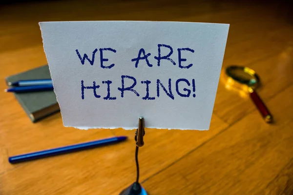 Writing note showing We Are Hiring. Business photo showcasing recently you employ someone or pay someone to do particular job Reminder paper base note rule pen magnifying glass electronic device. — 스톡 사진