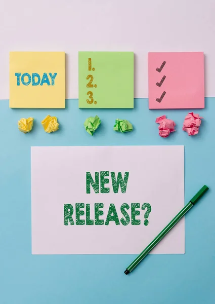 Conceptual hand writing showing New Release Question. Business photo text asking about recent product or service newly unleashed Stationary placed sideways on top of the softhued backdrop. — 图库照片