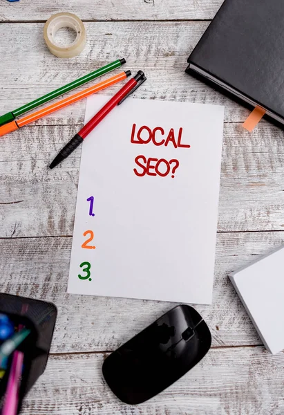 Conceptual hand writing showing Local Seoquestion. Business photo showcasing incredibly effective way to market your local business online Stationary and computer stuff pen with paper sheets on desk. — Stock Photo, Image