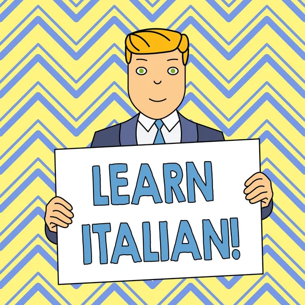 Word writing text Learn Italian. Business concept for gain or acquire knowledge of speaking and writing Italian Smiling Man Holding Formal Suit Big Blank Poster Board in Front of Himself.