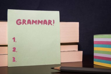 Conceptual hand writing showing Grammar. Business photo showcasing whole system structure language syntax and morphology Close up three wooden rectangle boxes paper pencil stack. clipart