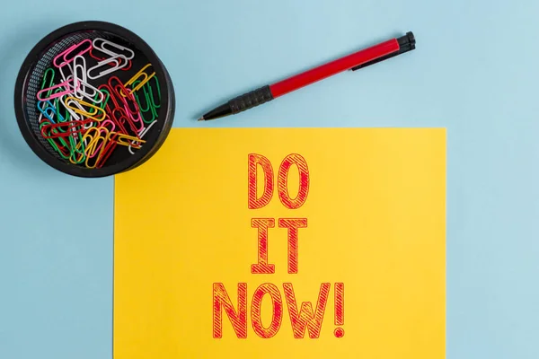 Text sign showing Do It Now. Conceptual photo not hesitate and start working or doing stuff right away.