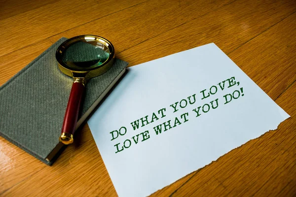 Text sign showing Do What You Love Love What You Do. Conceptual photo you able doing stuff you enjoy it to work in better places then Close up electronic device gadget magnifying glass resting wooden