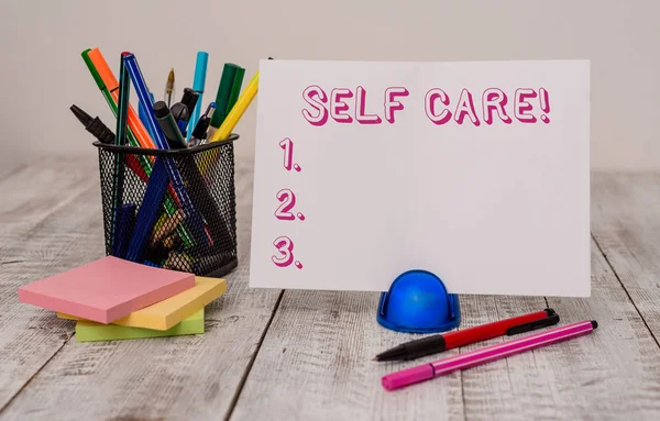 Writing note showing Self Care. Business photo showcasing practice of taking action to preserve or improve ones own health Stationary and computer mouse with globe on the wooden desk. — Stock Photo, Image