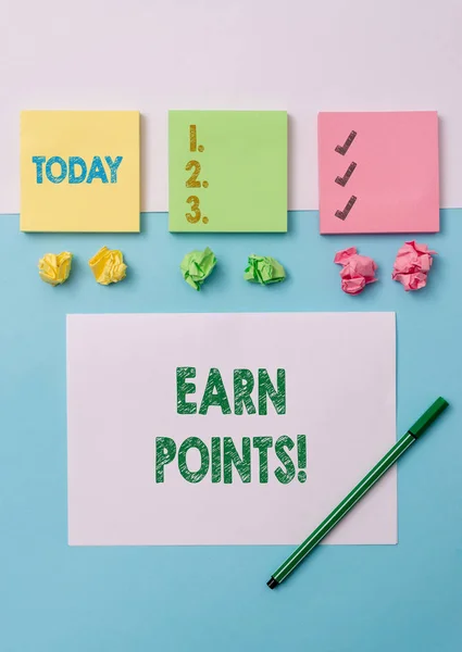 Conceptual hand writing showing Earn Points. Business photo text collecting scores in order qualify to win big prize Stationary placed sideways on top of the softhued backdrop.