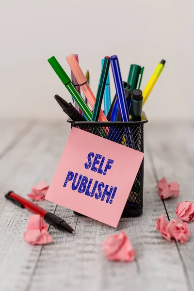 Writing note showing Self Publish. Business photo showcasing writer publish piece of ones work independently at own expense Writing equipment and paper scraps with blank sheets on the wooden desk. — 스톡 사진