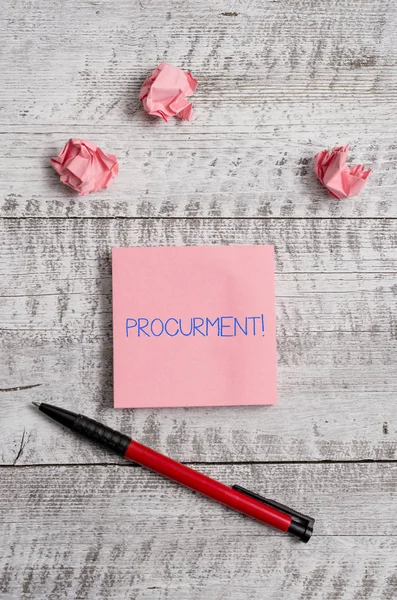Conceptual hand writing showing Procurment. Business photo showcasing action of acquiring military equipment and supplies Stationary and paper scraps with sheets on the wooden desk. — Stock Photo, Image