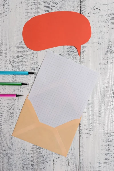 Front view open envelop speech bubble paper sheet ballpoints lying wooden old retro vintage rustic background. Empty text future important events. What to do office home school — 图库照片