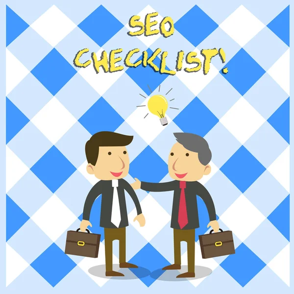 Texto de escritura Seo Checklist. Concepto que significa lista de artículos requeridos para optimizar el motor de búsqueda Dos Colegas de Negocios Blancos con Maletines compartiendo Idea de Solución . —  Fotos de Stock