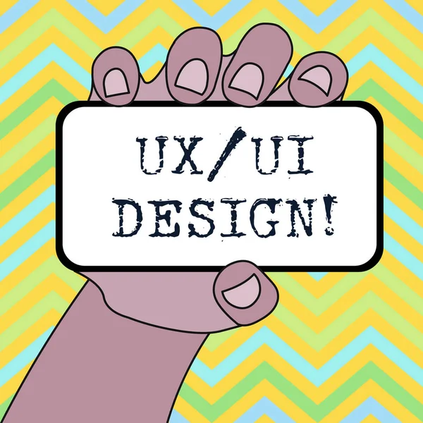Käsiala teksti Ux tai Ui Design. Käsite tarkoittaa kahta eri elementtiä yhden kuluttajan kokemus lähikuva älypuhelimen laite pidetään kädessä tyhjä näyttö ja tekstiavaruus . — kuvapankkivalokuva