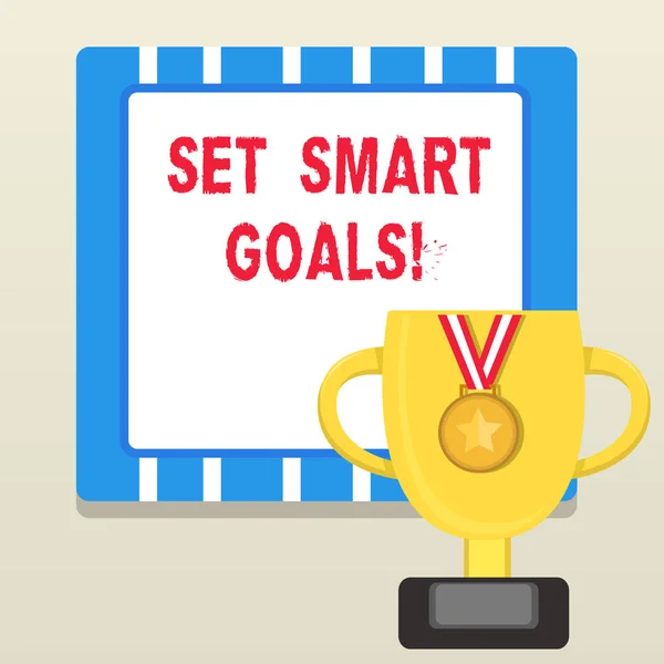 Word writing text Set Smart Goals. Business concept for list to clarify your ideas focus efforts use time wisely Trophy Cup on Pedestal with Plaque Decorated by Medal with Striped Ribbon.