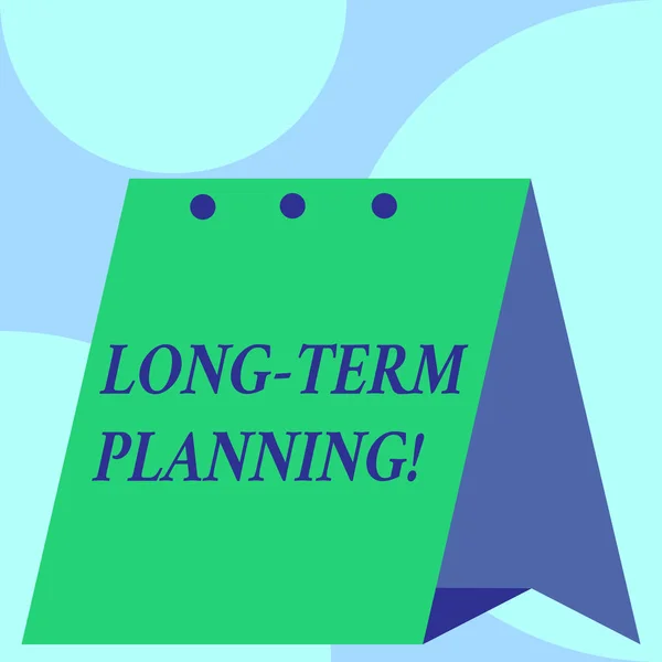Signo de texto que muestra la planificación a largo plazo. Foto conceptual estableciendo metas que usted esperaba alcanzar Calendario abierto de pie Escritorio planificador mensual Fondo geométrico . — Foto de Stock